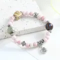Pink ceramic beaded bracelet variant featuring retro Chinese style charms and silver accessories. - Misty Fortune Mornings