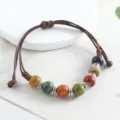 Handcrafted ceramic beaded bracelet with braided cord, ethnic style multi-color jewelry. - Colorful Round Beads