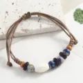 Retro ethnic handmade braided bracelet with ceramic porcelain beads for casual daily wear. - Seed-Shaped Ceramic, Splashed Sapphire Blue