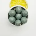 Close-up detail of 12mm green crackle glaze ceramic beads, perfect for DIY jewelry making. - 12mm (3.0mm Hole) / Floral Glaze Green & White