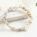 Nuovo braccialetto di perle in ceramica cinese con croce e farfalla per donna casual. - Sui Yue Yun (beige)