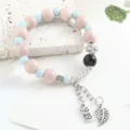 Bracciale in perle di ceramica cinese con perline rosa blu e ciondolo in metallo donna. - Quadrifoglio