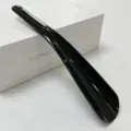 Black plastic shoehorn for home use, portable long handle lazy shoe helper, durable daily tool. - Solid Black