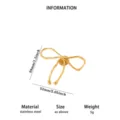 Golden stainless steel bow brooch, elegant twisted ribbon design, size 38x52mm, weight 5g. - Streamlined Bow Style (XZ469)