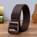 Detailed view of brown nylon tactical belt with metal buckle, durable canvas strap for men. - 125cm / Coffee