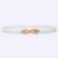 Detail view of a sweet elastic pearl waist belt with a gold leaf buckle for dresses. - 6