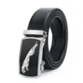 Close-up of men's leather belt buckle featuring a metallic leaping cat logo on black. - Style 16