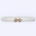 Detail view of double-row pearl elastic belt with sparkling rhinestone flower metal buckle. - 9