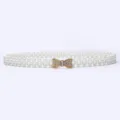 Detailed shot of a gorgeous women pearl waist belt with a sparkling rhinestone bow buckle. - 10