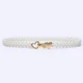 Pearl belt dress sweater waist chain with gold heart buckle, elegant women accessory detail. - 11