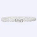 Close-up detail of a white pearl elastic waist belt with a sparkly rhinestone buckle. - 20