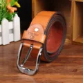 Closeup detail of a brown leather men belt with silver pin buckle, showing vintage texture. - 115cm / Camel
