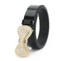 Close-up detail of luxurious gold rhinestone bow buckle on black patent leather belt. - Bowknot Rhinestone Style / Black
