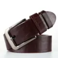 Detailed close-up of the stylish brown embossed leather belt with a polished silver metal pin buckle. - 115cm / Coffee