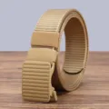 Detail shot of tactical nylon canvas belt with auto buckle for men, rolled up on wood table. - 125cm / Khaki
