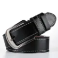 Detailed close-up view of a black men's pin buckle PU leather belt with stitching. - Black