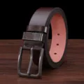 Detail view of mens brown leather belt with metal pin buckle, closeup texture and stitching. - 115cm / Coffee