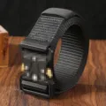 Tactical belt detail shot with durable black nylon webbing and heavy-duty quick-release buckle. - Black