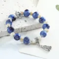 Jingdezhen kiln-change ceramic beaded bracelet with silver flower charm and tassel pendant. - Blue
