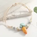 Ceramic carrot beaded bracelet detail shot, fresh style woven cord jewelry with spacer beads. - Carrot Style