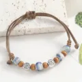 Vintage Jingdezhen ceramic beaded bracelet with adjustable braided rope and metal coins. - Glazed Gold Beige Blue