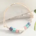 Minimalist ceramic bead bracelet with woven cord, chic handmade jewelry for women and girls. - Peanut Square Clear Aqua