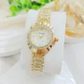 Elegant gold quartz women watch with rhinestone bezel and white dial, detail view. - Gold White