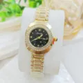 Luxury women rhinestone quartz watch with gold metal strap and black dial detailed closeup shot. - Gold Black