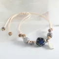 Chinese style Jingdezhen ceramic bead bracelet with blue flower pendant and adjustable braided cord. - Tiger Skin Blue Plum Blossom