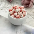Ceramic splatter glaze beads detail shot, showing red and white porcelain texture and holes. - 6mm / Red Flower