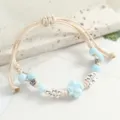 Handmade light blue ceramic bead braided bracelet for women, minimalist adjustable rope. - Electroplated Four-Leaf Clover Light Blue