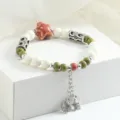 Bracciale di perle di ceramica fatto a mano in stile cinese con ciondolo a stella. - Stelle intrecciate rosa