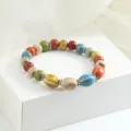 Bracciale di perle in ceramica multicolore stile cinese, gioiello elastico artigianale. - Motivo nuvole Lingmian