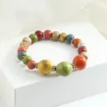 Bracciale con perle di ceramica colorate, stile etnico elastico gioiello alla moda. - Memoria di Brezza