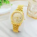 Luxury gold quartz wristwatch with diamond markers, fluted bezel, and calendar display. - For Women / Gold