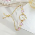 Delicate star and moon design ladies chain watch with purple enamel details and gold strap. - Drawstring Style (2026310) / Gold Purple