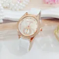 Detail shot of women watch featuring rose gold rhinestone bezel and white leather strap. - White