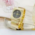 Chic gold square bangle watch for women, elegant quartz wristwatch with stylish wide strap. - Gold Black