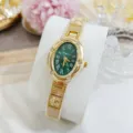 Montre à quartz ovale dorée avec cadran vert, chiffres romains et lunette strassée. - Boîtier Doré Cadran Vert