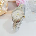 Close-up of women quartz watch, silver gold tone, rhinestone bezel and sparkly metal strap. - Two-tone (Gold & Silver)