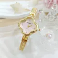 Elegante orologio al quarzo trifoglio con bracciale in maglia dorata stile lusso chic. - Polvere d'oro
