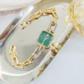 Montre quartz femme élégante cadran vert bracelet à maillons stylé accessoire mode chic. - Or Vert