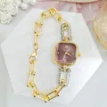 Detailed close-up of a luxury square dial quartz watch with stylish chain link strap. - Gold Red