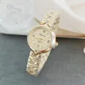Elegant women's quartz watch featuring gold metal strap, Roman numerals and clear dial. - Gold