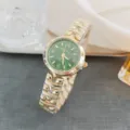 Elegant women quartz watch with green dial roman numerals and gold stainless steel strap. - Gold & Green