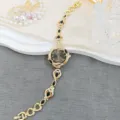 Vintage gold quartz watch for women, black teardrop crystal bracelet design, luxury vintage style. - Black