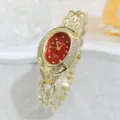 Detailed close-up of Eliyina oval red dial rhinestone gold quartz ladies bracelet watch. - Gold Red