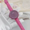 Close up of women quartz watch with pink leather strap, purple rhinestone dial and floral motif. - Rose Red