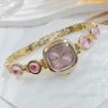 Elegante goldene Damenuhr mit rosa Zifferblatt und edlem Schmucksteinarmband Luxus - Rosa