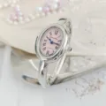 Vintage oval quartz bangle watch for women featuring a pink dial and Roman numerals. - Regular Fit / Silver Pink